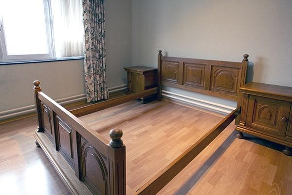 the bed frame removal process involves disassembling the frame, removing it from the room, and disposing of it properly